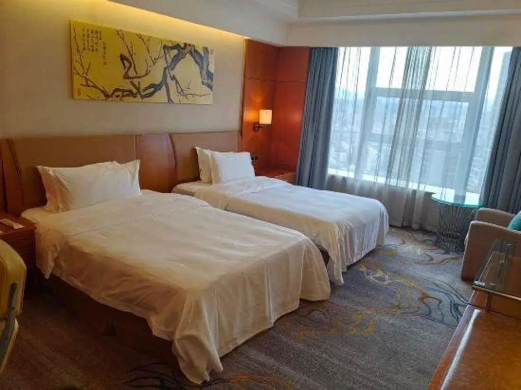 Bed in Fuyang International Trade Centre Hotel