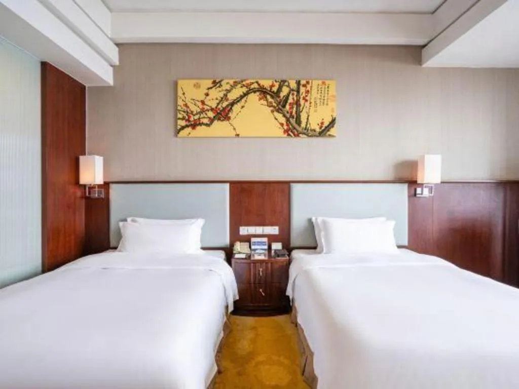 Bed in Fuyang International Trade Centre Hotel