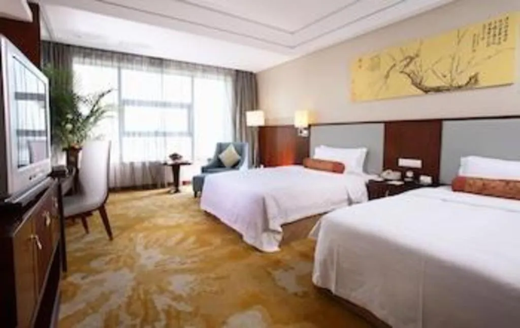 Bed in Fuyang International Trade Centre Hotel