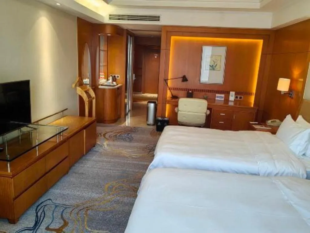 Bed in Fuyang International Trade Centre Hotel