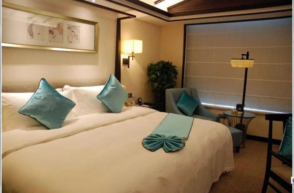 Bed in Fuyang International Trade Centre Hotel
