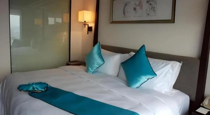 Bed in Fuyang International Trade Centre Hotel