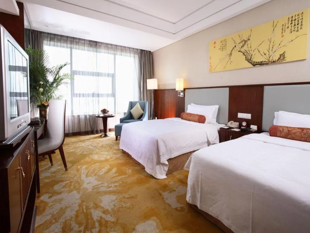 Bed in Fuyang International Trade Centre Hotel