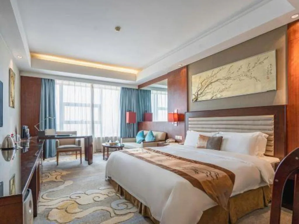 Bed in Fuyang International Trade Centre Hotel