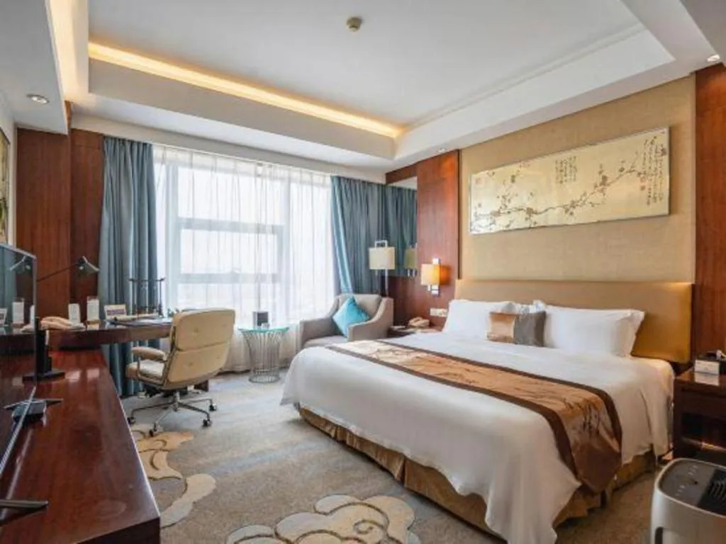 Bed in Fuyang International Trade Centre Hotel