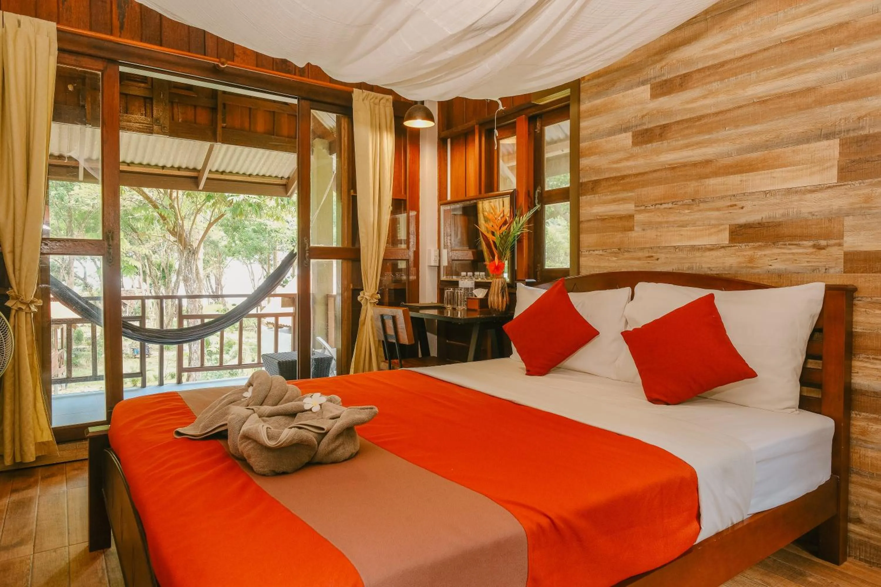 Bed in JOY Bungalow Resort and Restaurant