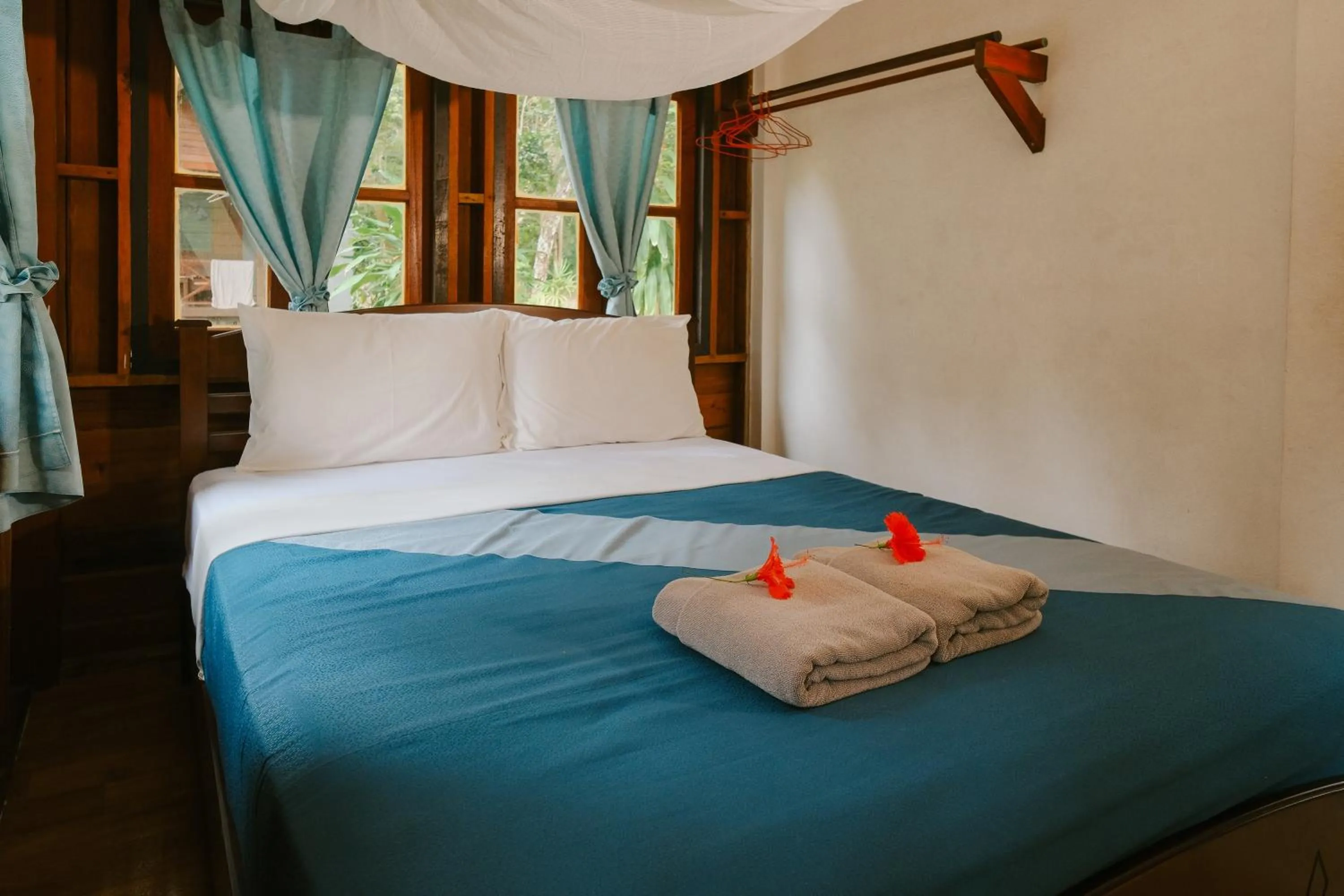 Bed in JOY Bungalow Resort and Restaurant