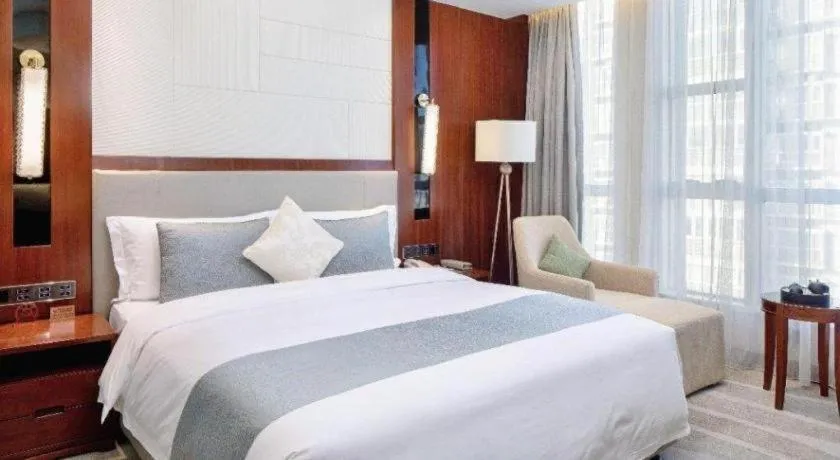 Bed in Grand Soluxe Zhongyou Hotel Shenzhen