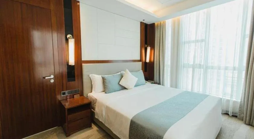 Bed in Grand Soluxe Zhongyou Hotel Shenzhen