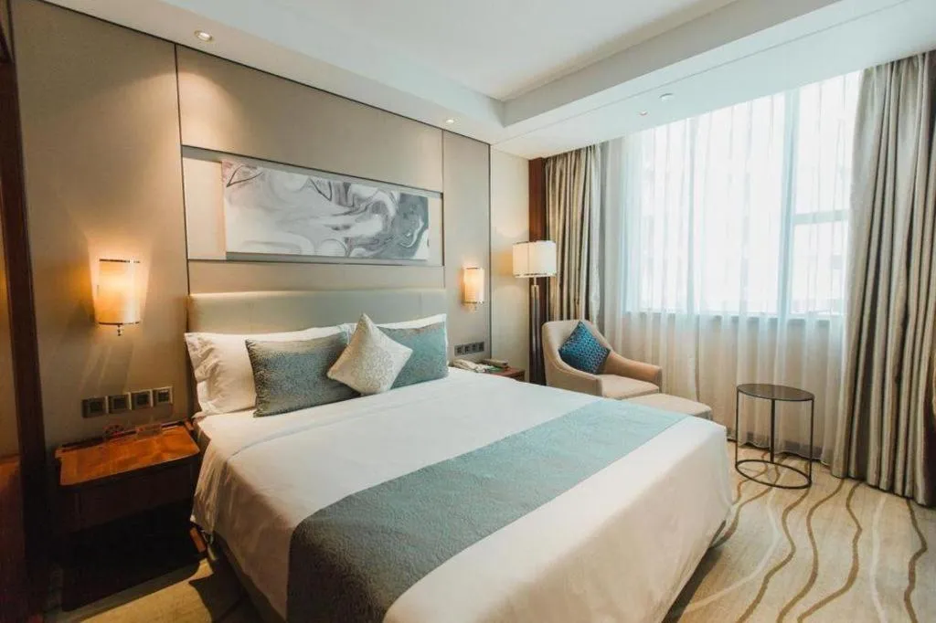 Bed in Grand Soluxe Zhongyou Hotel Shenzhen