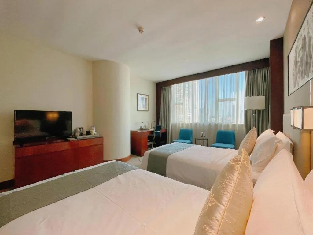 Bed in Grand Soluxe Zhongyou Hotel Shenzhen