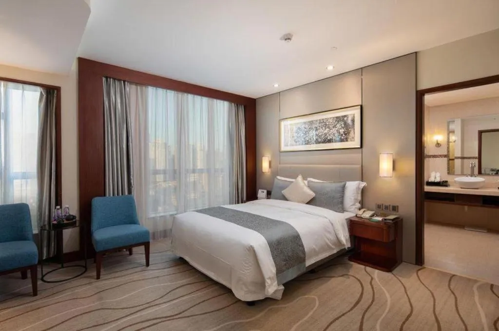 Bed in Grand Soluxe Zhongyou Hotel Shenzhen