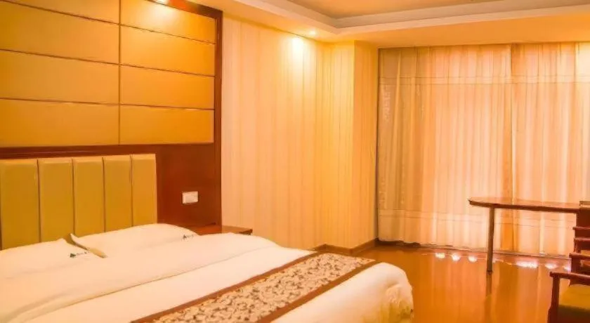 Bed in GreenTree Inn Chuzhou City Quanjiao County High-Speed Italy Trade City Business Hotel