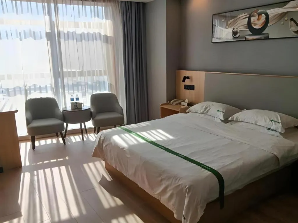 Bed in GreenTree Inn Chuzhou City Quanjiao County High-Speed Italy Trade City Business Hotel