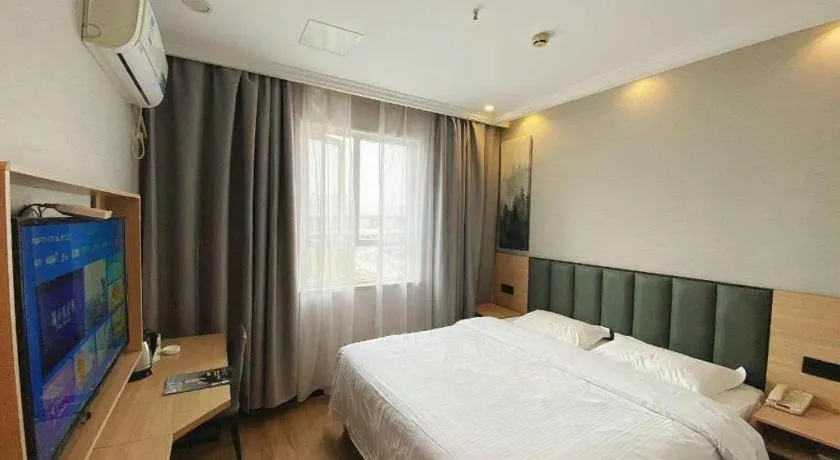 Bed in GreenTree Inn Taizhou New District Hospital of Renmin Hospital Mingliu Express Hotel