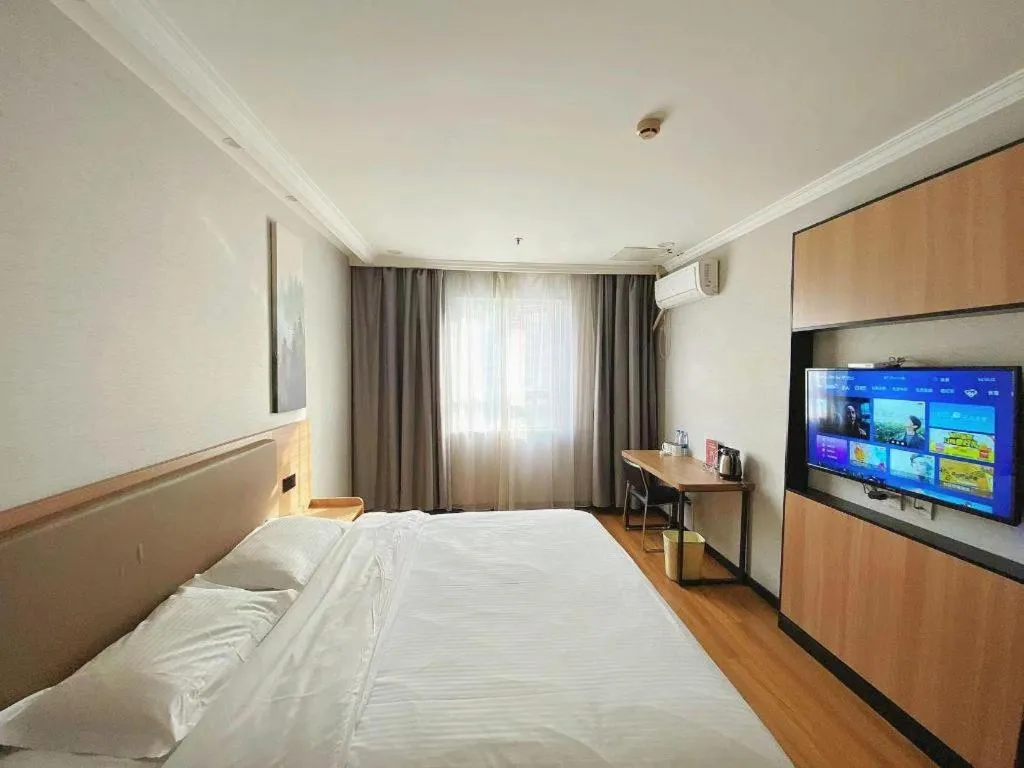 Bed in GreenTree Inn Taizhou New District Hospital of Renmin Hospital Mingliu Express Hotel