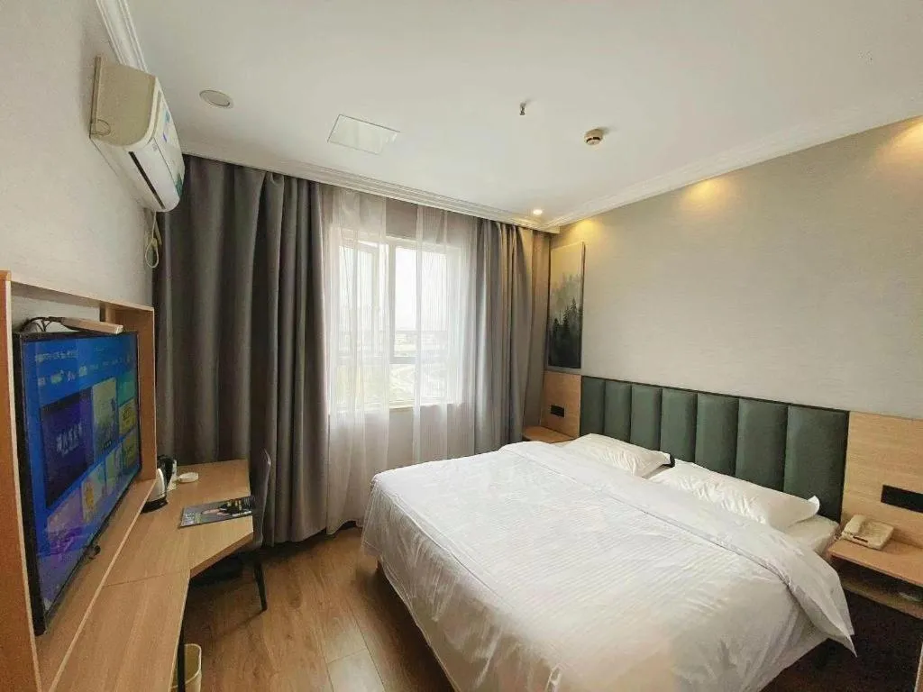 Bed in GreenTree Inn Taizhou New District Hospital of Renmin Hospital Mingliu Express Hotel