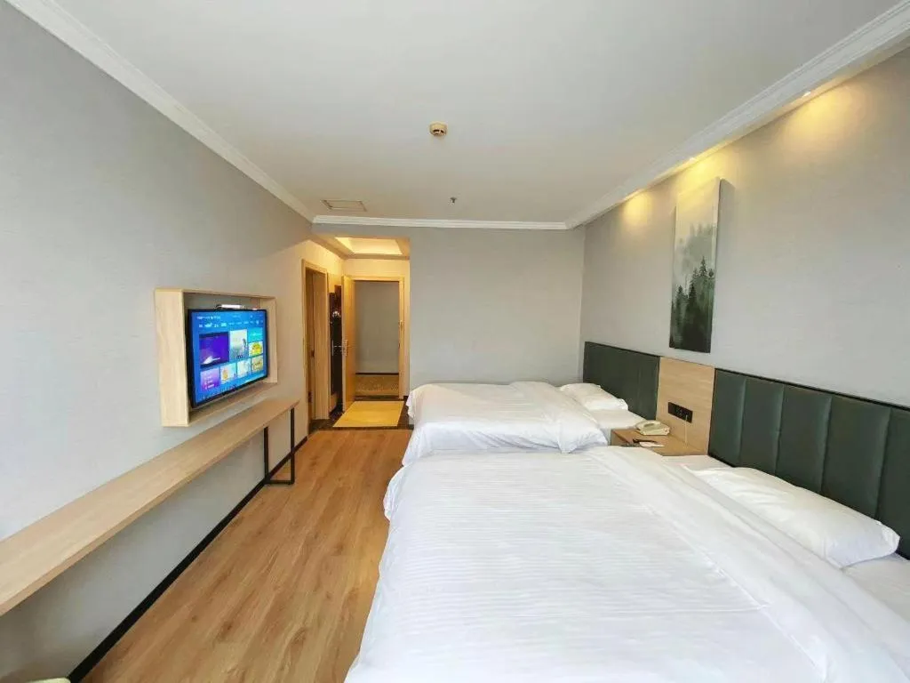 Bed in GreenTree Inn Taizhou New District Hospital of Renmin Hospital Mingliu Express Hotel