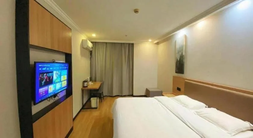 Bed in GreenTree Inn Taizhou New District Hospital of Renmin Hospital Mingliu Express Hotel