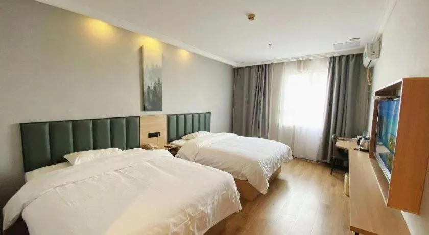 Bed in GreenTree Inn Taizhou New District Hospital of Renmin Hospital Mingliu Express Hotel