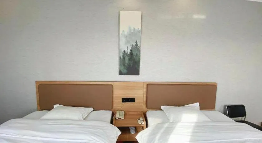 Bed in GreenTree Inn Taizhou New District Hospital of Renmin Hospital Mingliu Express Hotel