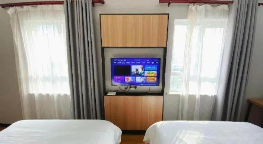 Bed in GreenTree Inn Taizhou New District Hospital of Renmin Hospital Mingliu Express Hotel