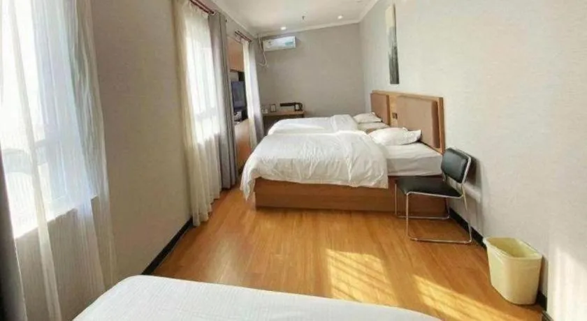 Bed in GreenTree Inn Taizhou New District Hospital of Renmin Hospital Mingliu Express Hotel