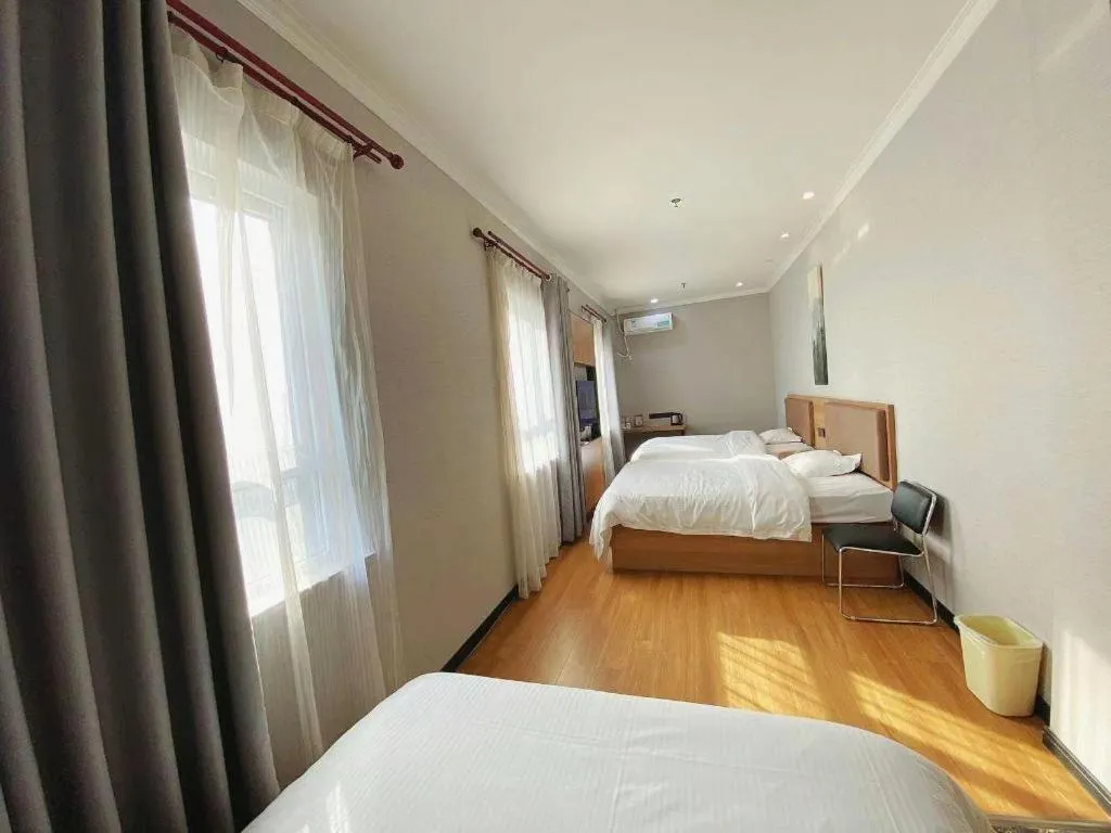 Bed in GreenTree Inn Taizhou New District Hospital of Renmin Hospital Mingliu Express Hotel