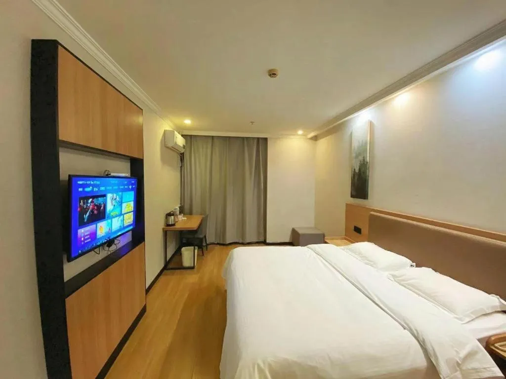 Bed in GreenTree Inn Taizhou New District Hospital of Renmin Hospital Mingliu Express Hotel
