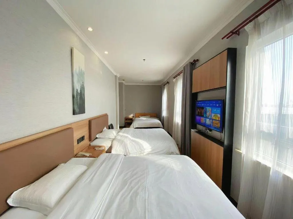 Bed in GreenTree Inn Taizhou New District Hospital of Renmin Hospital Mingliu Express Hotel