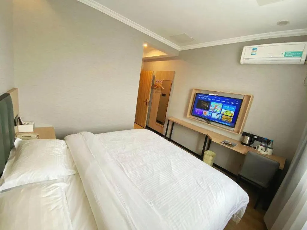 Bed in GreenTree Inn Taizhou New District Hospital of Renmin Hospital Mingliu Express Hotel