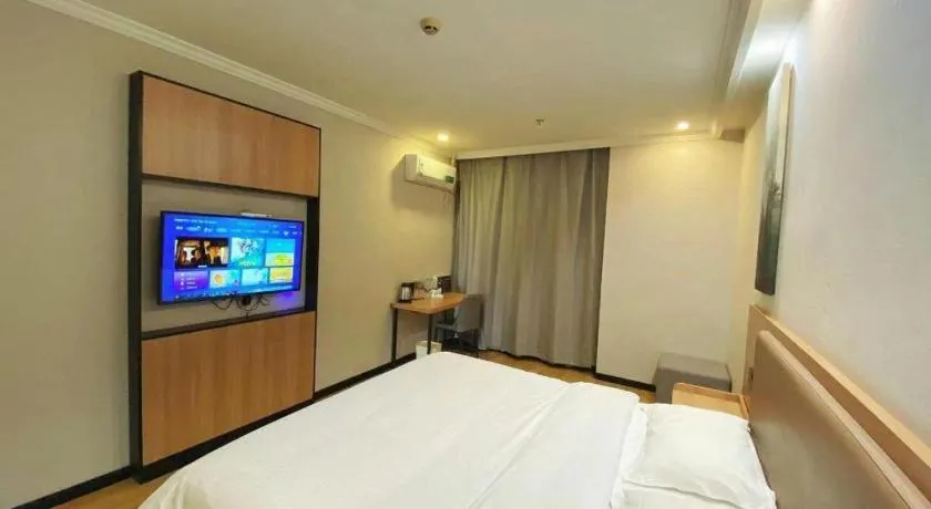 Bed in GreenTree Inn Taizhou New District Hospital of Renmin Hospital Mingliu Express Hotel