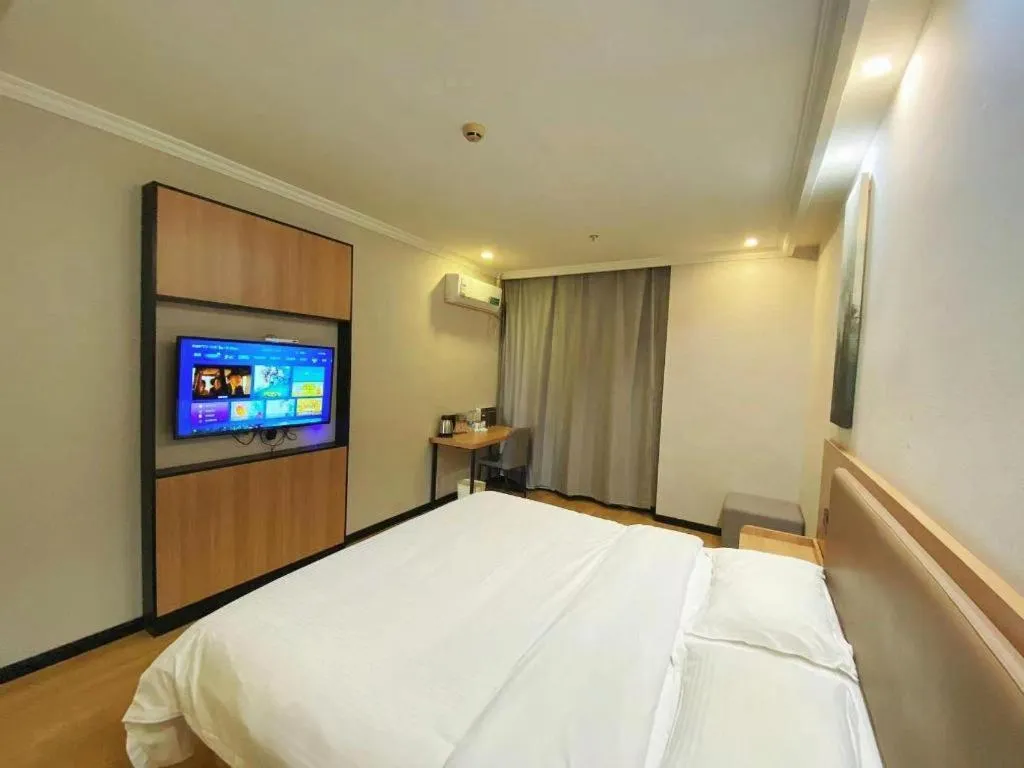 Bed in GreenTree Inn Taizhou New District Hospital of Renmin Hospital Mingliu Express Hotel