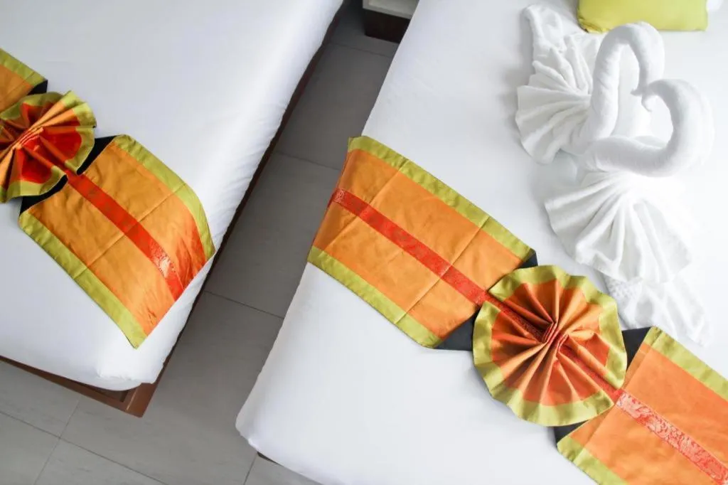 Bed in Elegancy Sansabai Hotel