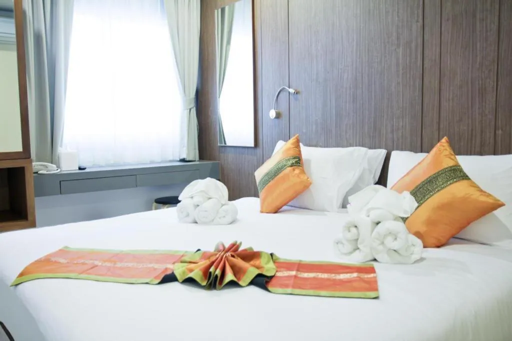 Bed in Elegancy Sansabai Hotel