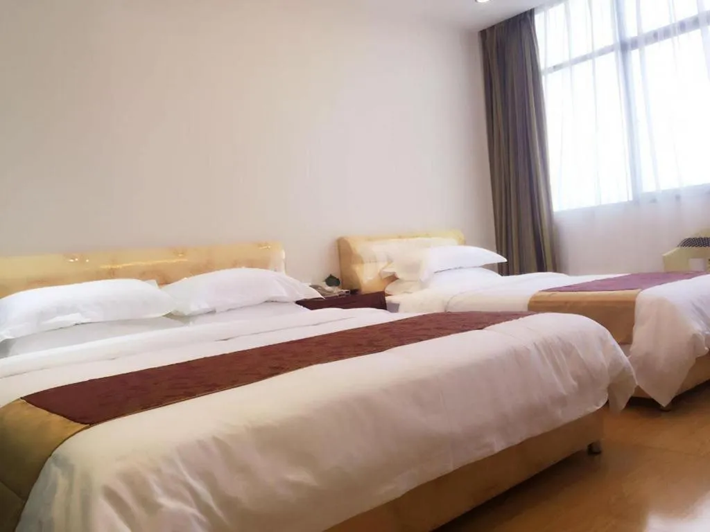 Bed in Jian Guo Grand Hotel