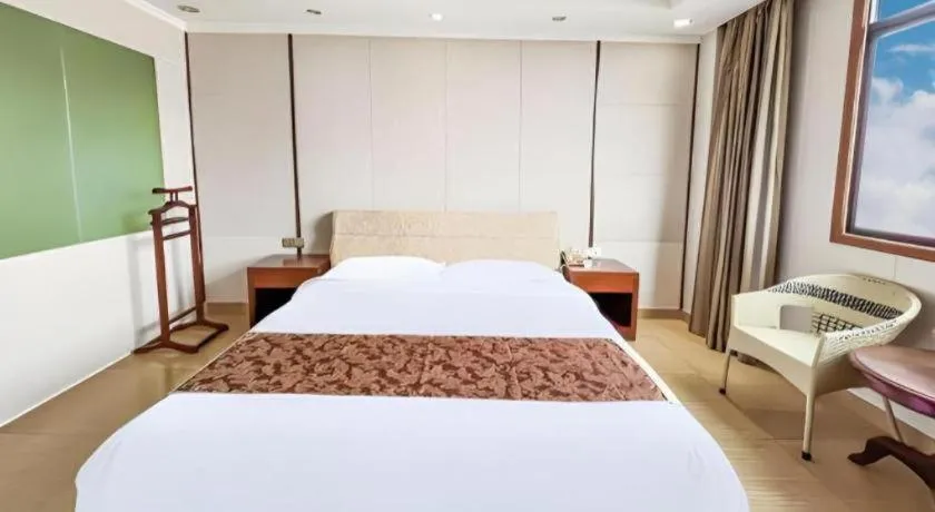 Bed in Jian Guo Grand Hotel