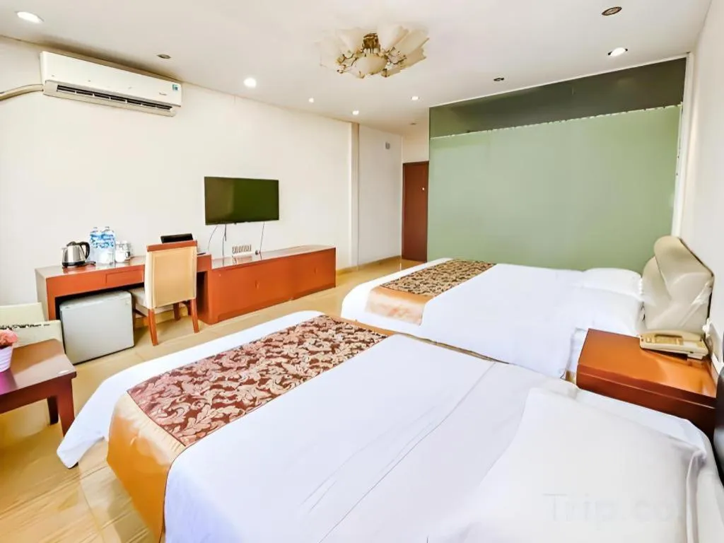 Bed in Jian Guo Grand Hotel