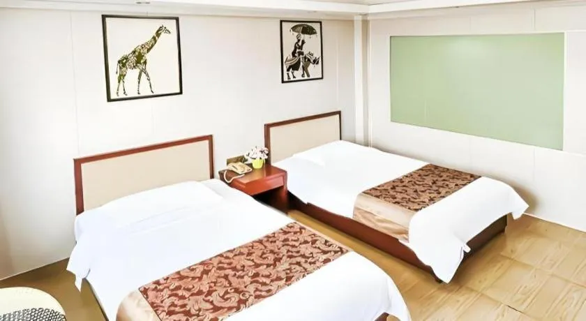 Bed in Jian Guo Grand Hotel