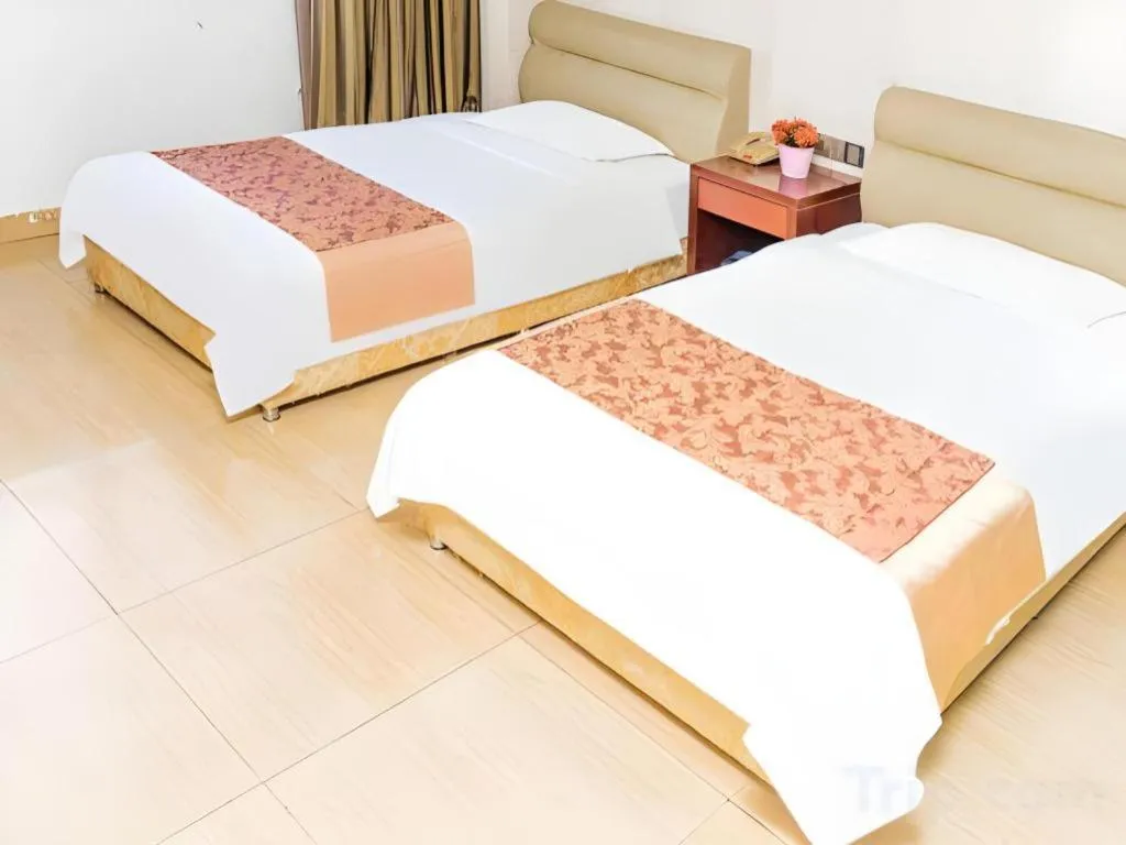 Bed in Jian Guo Grand Hotel