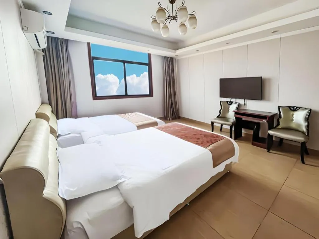 Bed in Jian Guo Grand Hotel