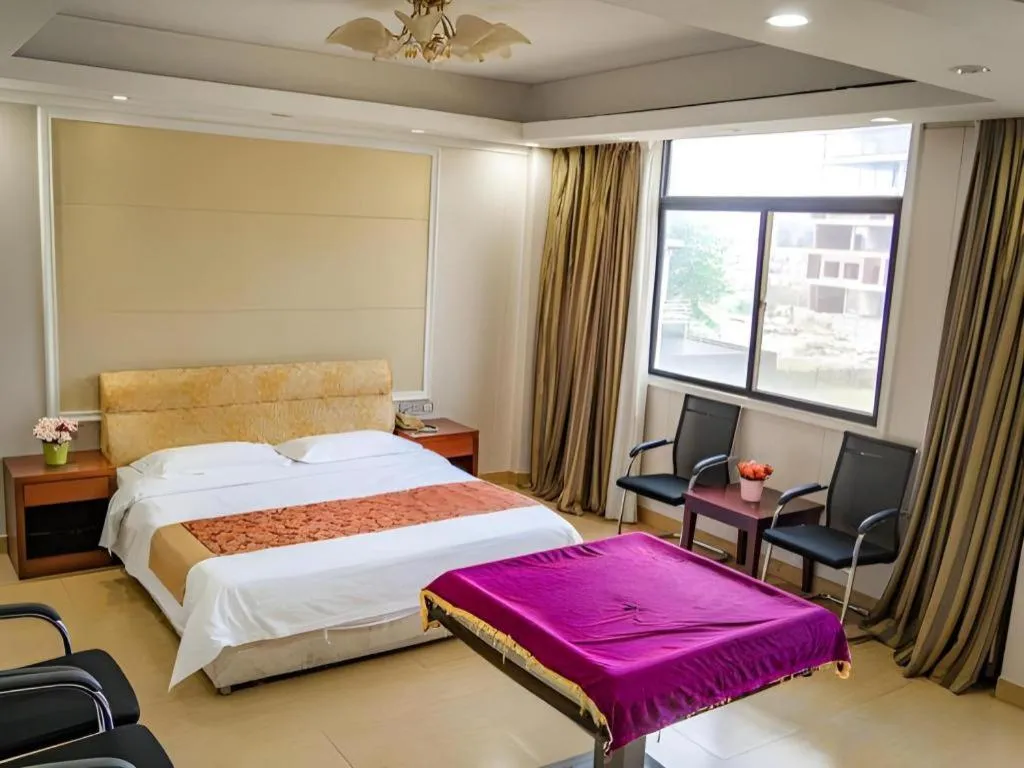 Bed in Jian Guo Grand Hotel