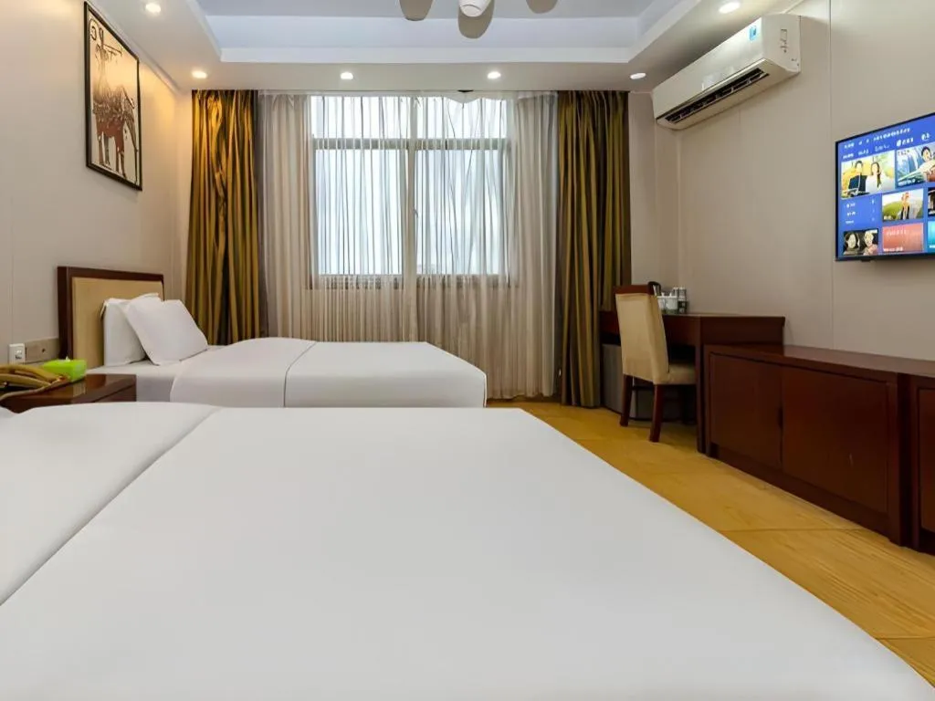 Bed in Jian Guo Grand Hotel