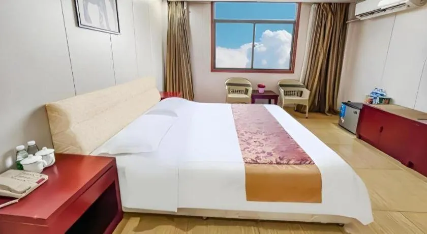 Bed in Jian Guo Grand Hotel