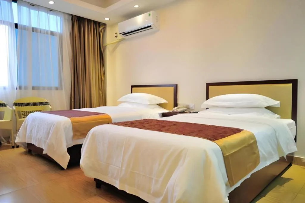 Bed in Jian Guo Grand Hotel