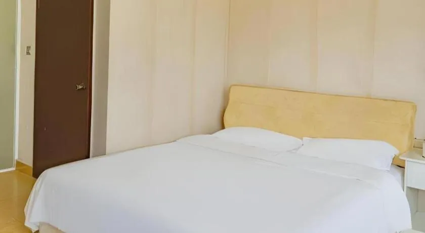 Bed in Jian Guo Grand Hotel