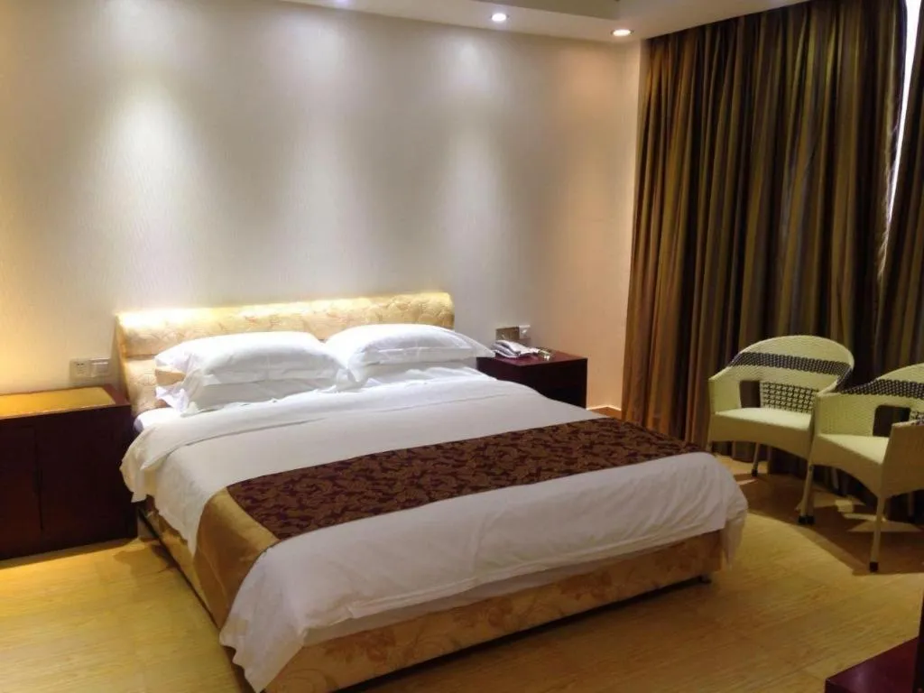 Bed in Jian Guo Grand Hotel