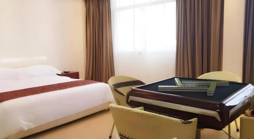 Bed in Jian Guo Grand Hotel