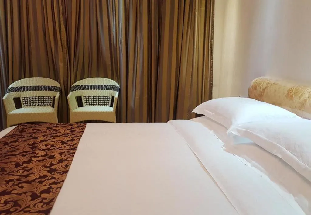 Bed in Jian Guo Grand Hotel