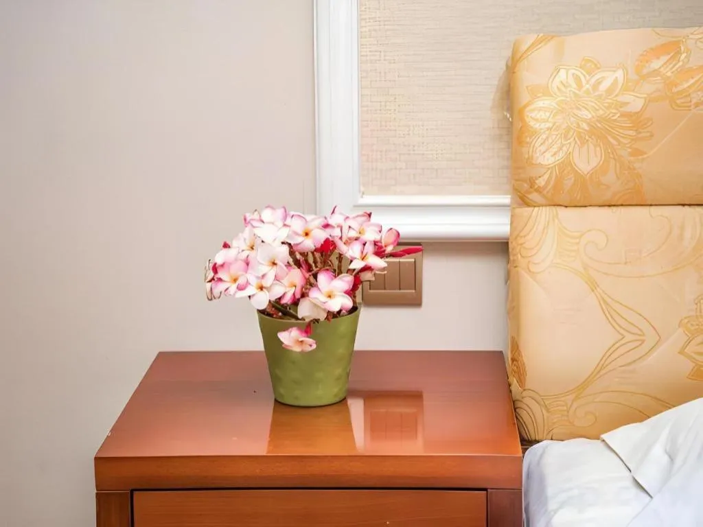 Bed in Jian Guo Grand Hotel